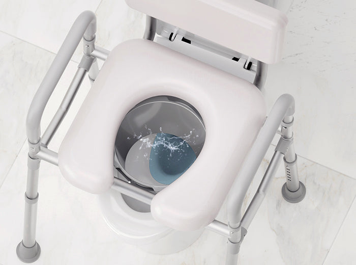 Top view of HOMLAND C9 bedside commode showing the padded seat and built-in splash guard inside the bucket